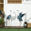 2er-Set Gartenstatuen: Reiher-Skulpturen aus Stahl für Teich, Terrasse, Veranda, Rasen, 74/70 cm, bunt